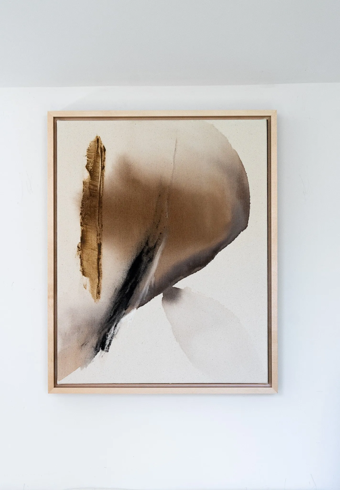 Earthen Glow, black walnut ink, acorn caps, charcoal and rock on raw canvas, wooden floater frame by Rachel Reinert